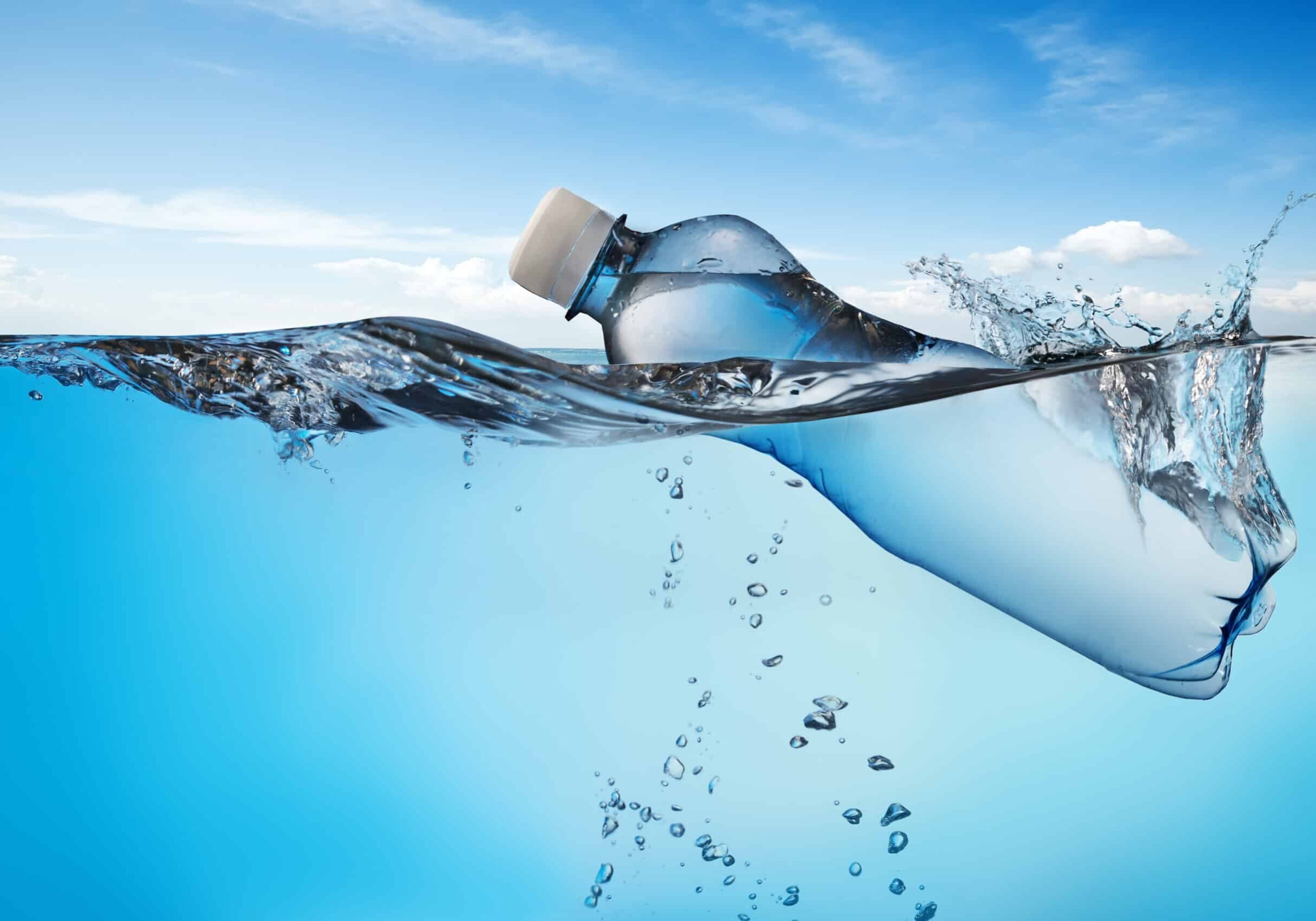 Swimming,Bottle,Of,Water,In,Water,On,Sky,Background