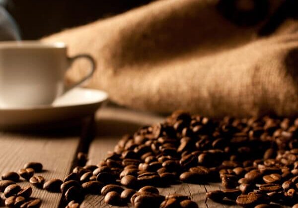 Coffee,Background,With,Beans,And,White,Cup.