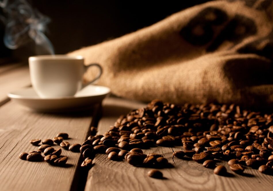 Coffee,Background,With,Beans,And,White,Cup.